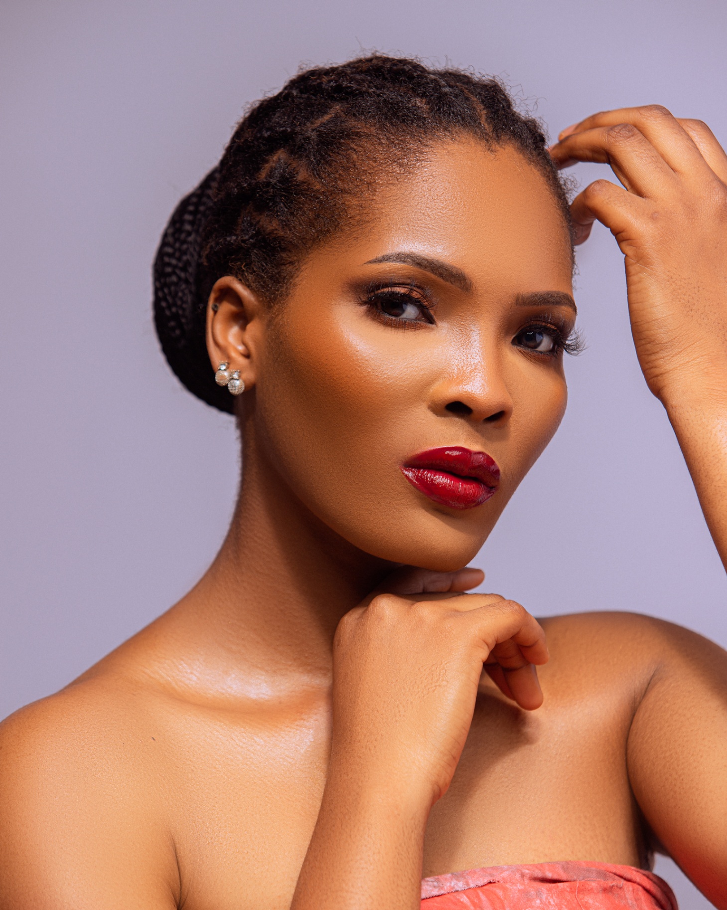 Editorial close-up with a bold red lip
